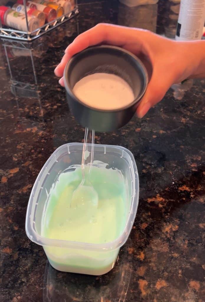 green glue with spoon in it
