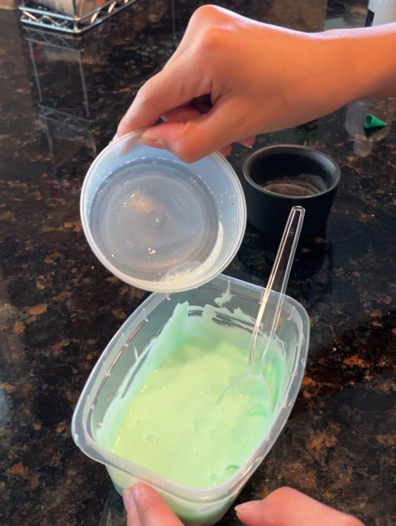 pouring liquid into green glue