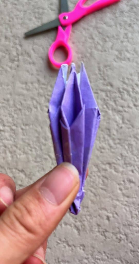 Folding in blank sides of origami lily