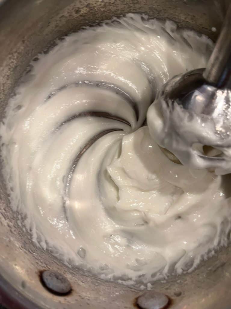 immersion blender mixing homemade lotion