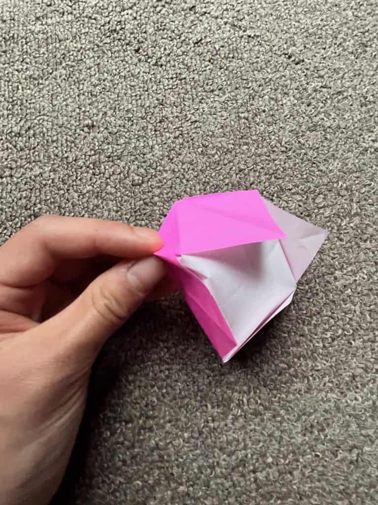 creasing corner of origami crown
