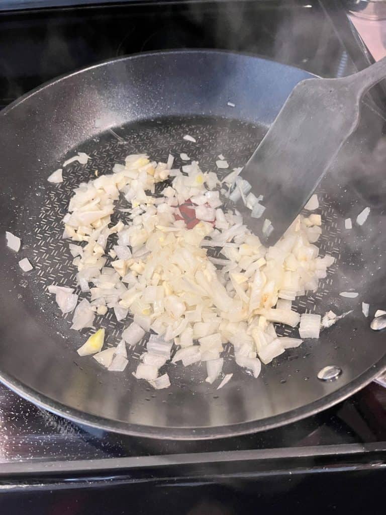 chopped onions cooking in pan