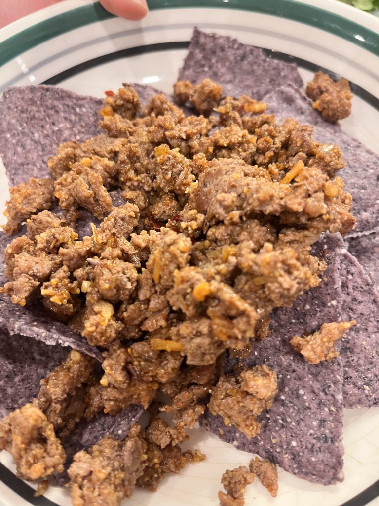 tortilla chips with ground beef on top
