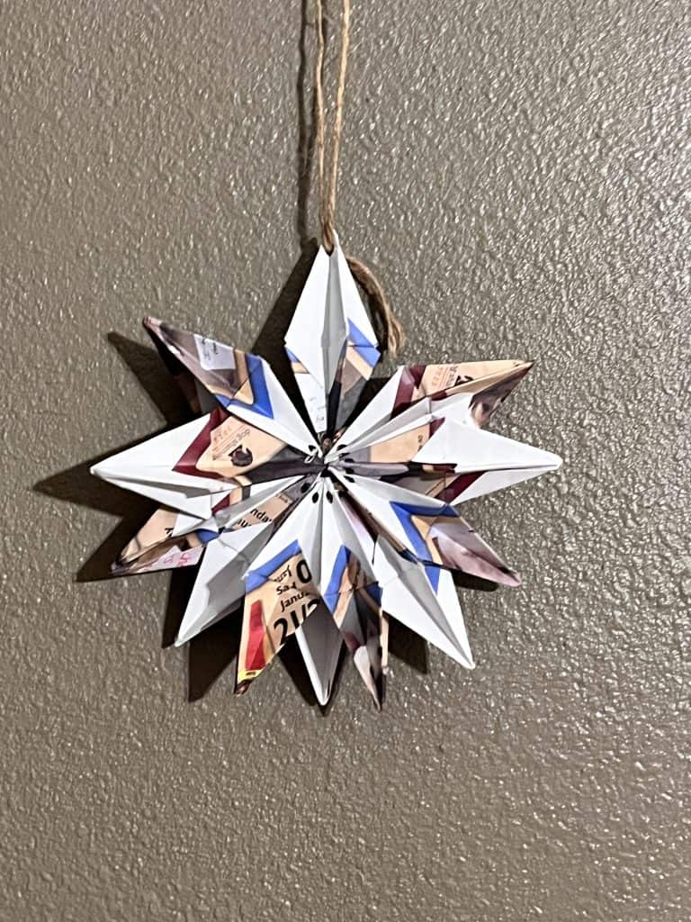 snowflake origami hanging on wall
