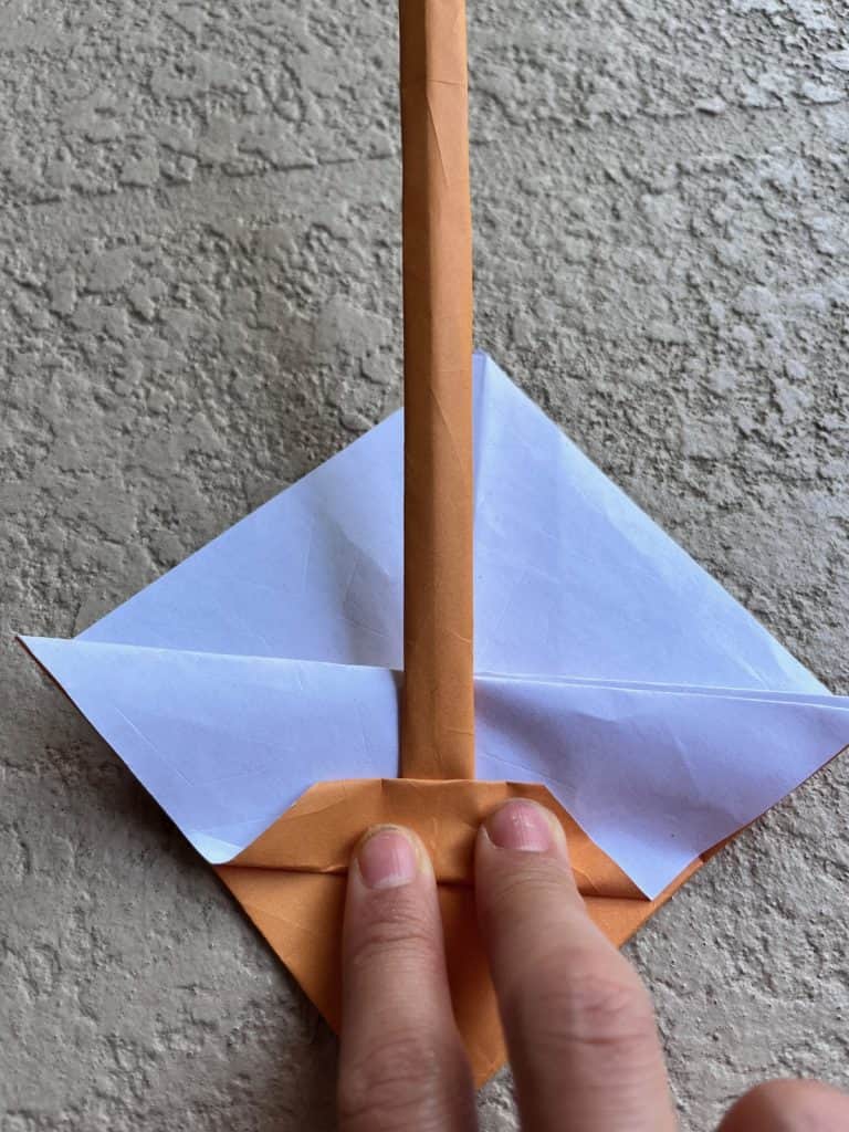 Adding the handle to origami basket